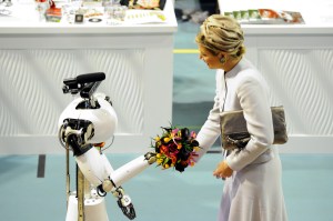 her majesty Máxima, Queen of the Netherlands, receives flowers from AMIGO, the Eindhoven Tech United servicerobot from RoboCup@Home, at RoboCup 2013 in Eindhoven (NL)